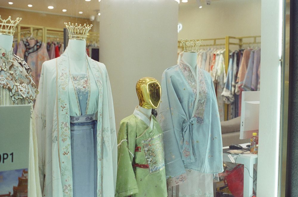 A wall of Hanfu garments on a shop rack — the kind of selection you navigate when buying Hanfu