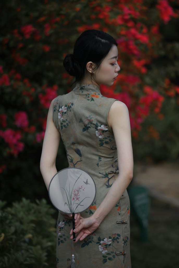 Woman wearing a red qipao (cheongsam), the fitted 20th-century Chinese dress